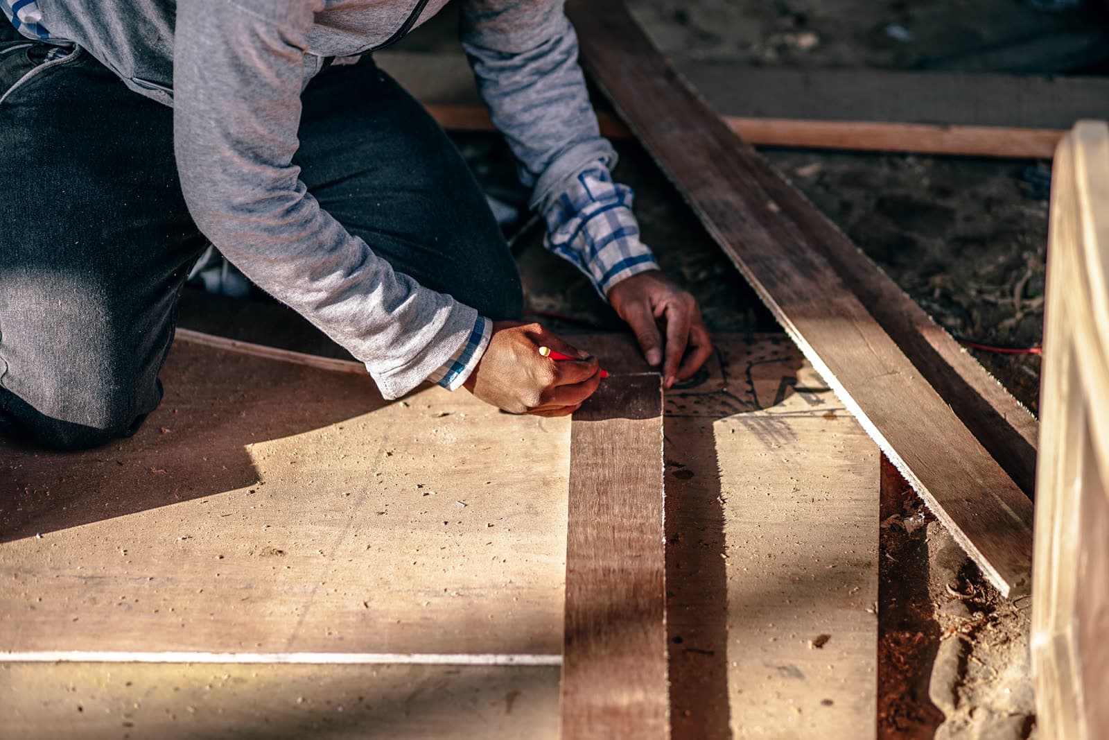 A joiner marking a length of timber